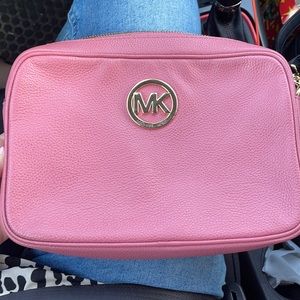 Barely used crossbody Michael Kors purse.